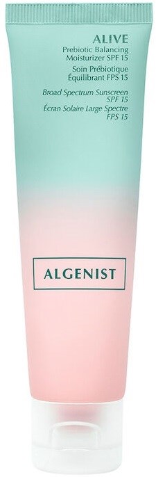En pastellfärgad tub med hudvårdskräm med text, varumärket Algenist och SPF 15-skydd.