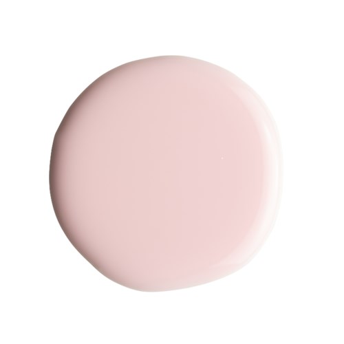Ett mjukt rosa runt objekt med slät yta, placerad i mitten på en vit bakgrund.