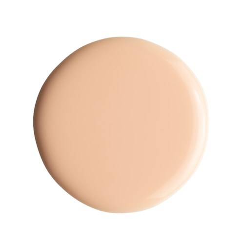 En beige, rund föremål med glänsande yta och slät textur. Det ser ut som en nära bild av en makeupprodukt eller en hudprodukt.