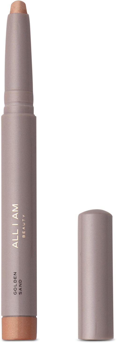 En beige makeup-penna med korken borttagen, som visar produkten inuti. Pennan är märkt "ALL I AM" och "GOLDEN SUNSET."