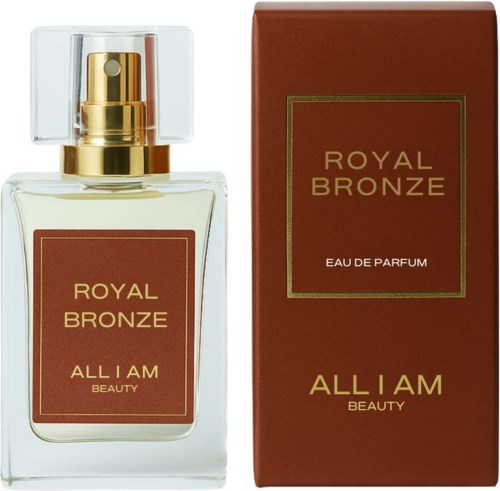 En parfyllare med etiketten 'Royal Bronze' och en matchande box med guldtext. Flaskan har ett klart lock och spray.