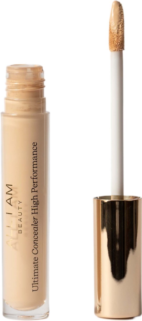 Beige peiteaineputki kultainen korkki ja teddymuotoisella applikaattorilla. Teksti: "L.A. Girl Ultimate Concealer."
