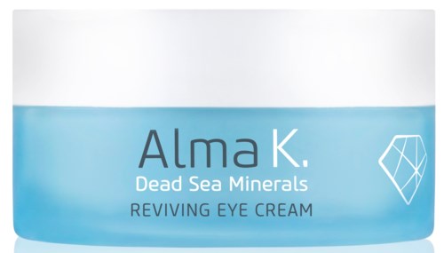 En krukke med øyekrem kalt Alma K Dead Sea Minerals Reviving Eye Cream med blå emballasje og hvit lokk.