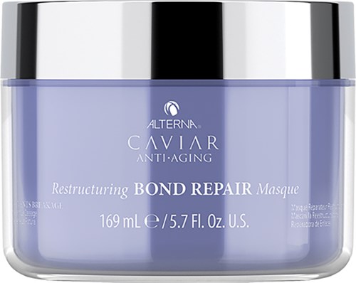 Blå krukke med svart og sølv lokk, merket 'Alterna Caviar Anti-Aging Restructuring Bond Repair Masque'.