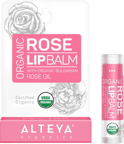 Pudełko i tubka organicznego bułgarskiego różanego balsamu do ust z ilustracjami róż, certyfikat USDA organic, różowa opakowanie.