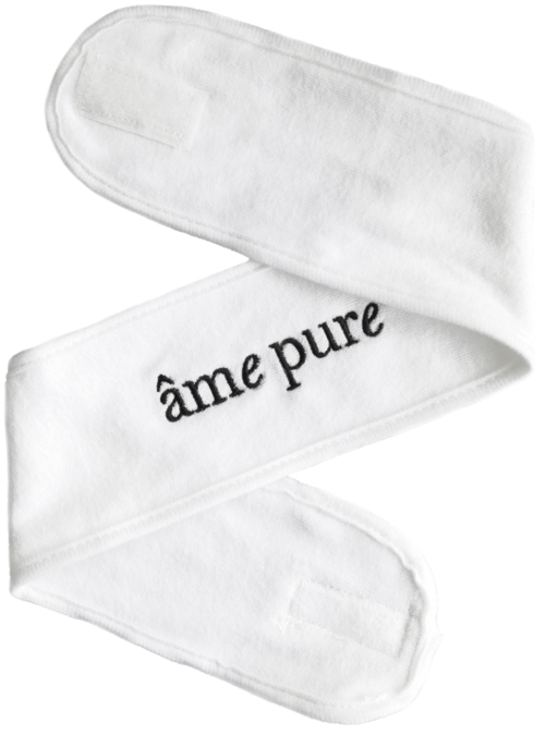 En hvit stoffremse med orden "âme pure" brodert på. Den er brettet i en zigzag-form.