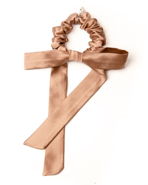 Ett beige tygband med en rosett, formad som bokstaven 'Z'.