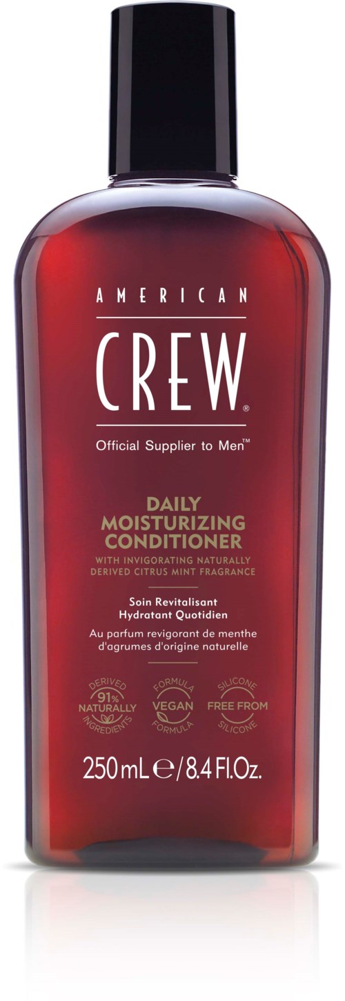 En rød flaske med svart lokk, merket American Crew Daily Moisturizing Conditioner, forherrepleie.