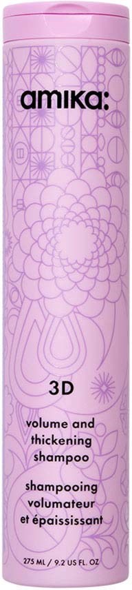 Ljuslila schampoflaska med geometriska och blomsterlika mönster, märkt 'Amika 3D volume and thickening shampoo.'
