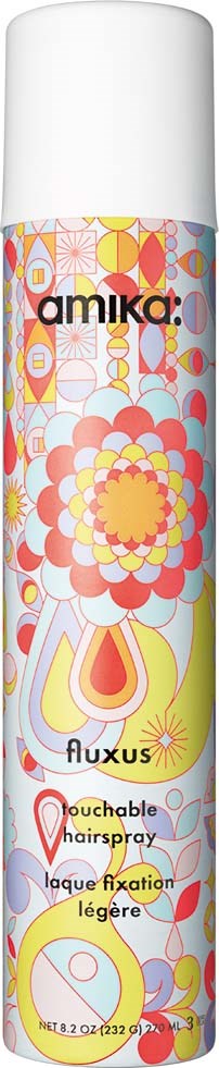 Farverig cylindrisk dåse med blomster- og abstrakte mønstre, mærket 'amika' og 'fluxus' til berøringsvenlig hårspray.