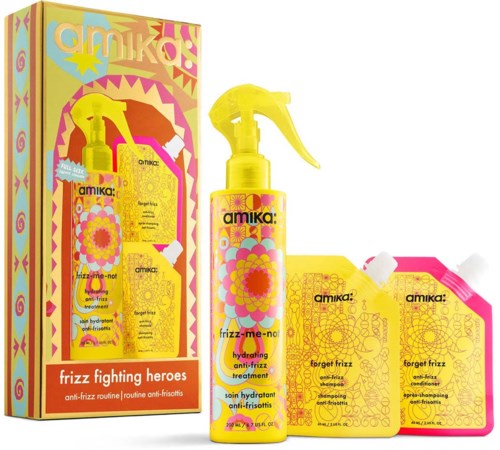Yellow spray bottle and shampoo and conditioner sachets from Amika Frizz Fighting Heroes set, with colorful packaging.