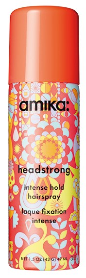 Ljust blommönster på en hårsprayburk med orange lock, märkt 'Amika Headstrong,' för att hålla håret stadigt.