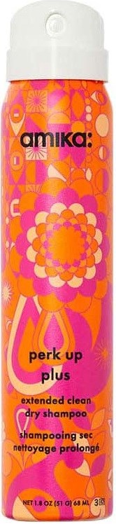 A tall, colorful bottle with a psychedelic orange and pink floral design, labeled as Amika perk up dry shampoo.