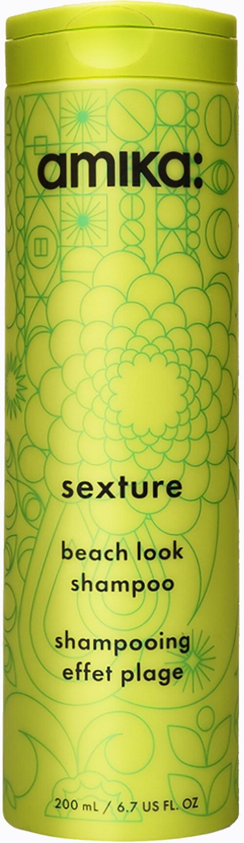 Kirkkaan keltainen astia, jossa vihreitä kuvioita, musta teksti, näyttää tuotemerkin 'amika' ja tuotteen 'sexture beach look shampoo'.
