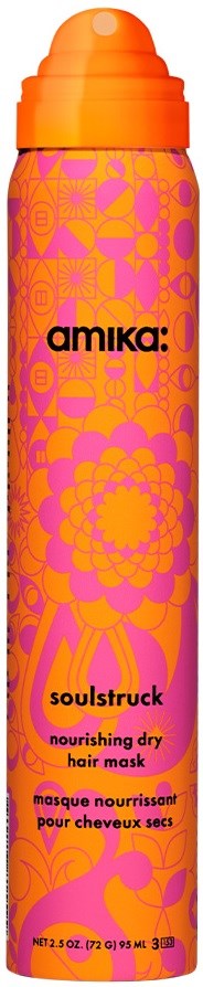 En lys orange og lyserød flaske med blomsterprint og teksten Amika Soulstruck nærende tør hårmaske.