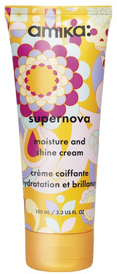 Färgglad tub med Amika Supernova fuktighets- och glanskräm med blommiga och abstrakta mönster.
