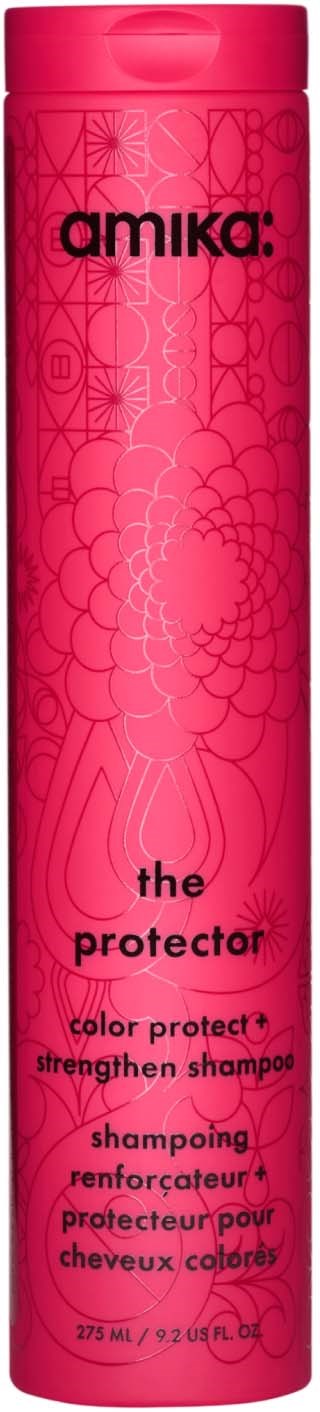 En høj, rosa flaske af Amika the protector color protect styrkende shampoo med dekorative blomster mønster.
