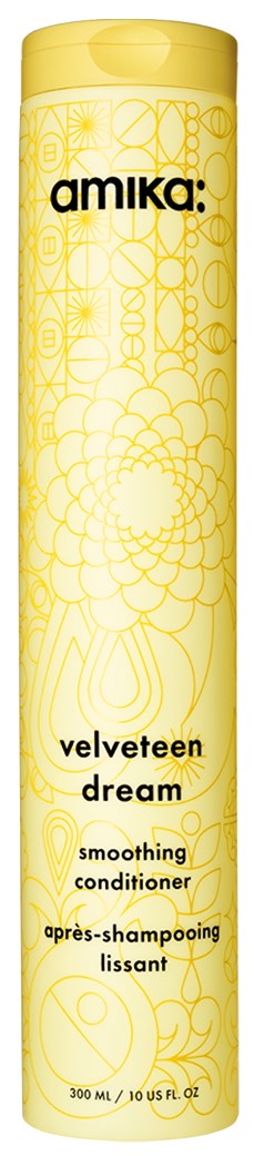 Yellow cylindrical bottle of Amika velveteen Dream smoothing conditioner with floral patterns and black text.