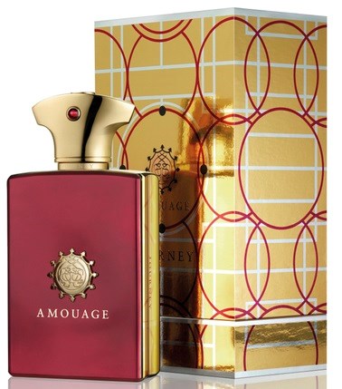 A perfume bottle with a gold cap, pink body, and a box decorated with red circles and gold patterns.