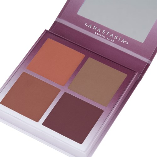 A compact makeup palette with four shades in a purple case, with the brand 'Anastasia Beverly Hills' on the lid.