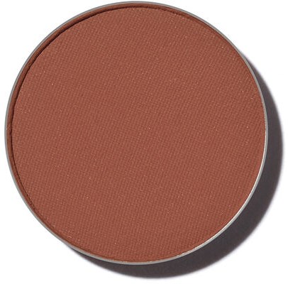 En rund makeup-rouge i brunt nyans. Ytan är slät med ett lätt texturerat mönster.