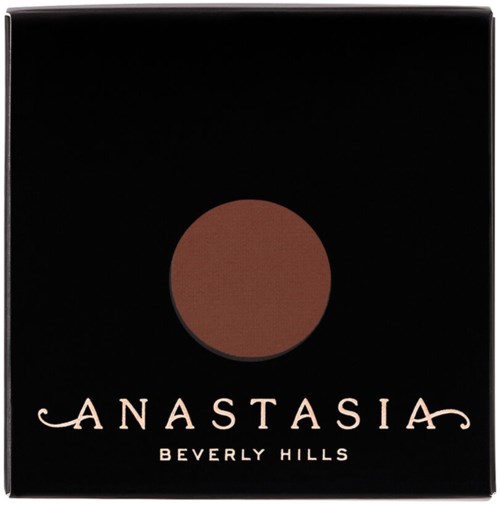 Bildet visar en svart box med en brun cirkel och orden 'Anastasia Beverly Hills'.