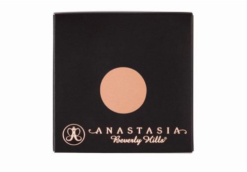 En svart box med en persikofärgad cirkel och guldig text som säger 'ANASTASIA Beverly Hills'.