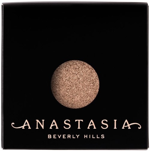 En svart box med en glittrig guldig cirkellogo och texten 'Anastasia Beverly Hills.'