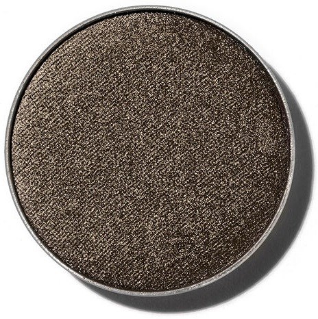 En rund ögonskuggspalett med mörk, skimrande brunt och texturerad yta.