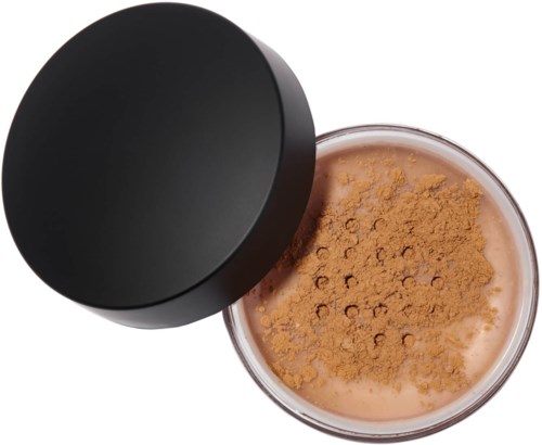 A small round pot filled with loose brown powder, partially covered by a black lid.