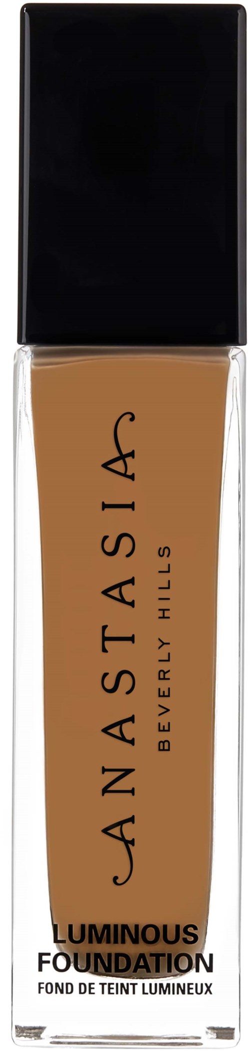 Pitkä meikkipullo, jossa beige neste, musta korkki ja Cannastasia Beverly Hills -Logo.