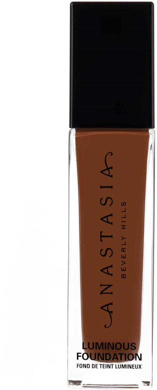 Eine Flasche mit braunem flüssigem Make-up und schwarzem Deckel, etiketti als Anastasia Beverly Hills Luminous Foundation.