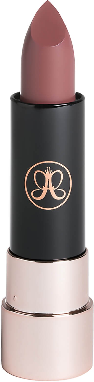 A lipstick with a pinkish-brown color in a black tube with a rose gold cap and logo.