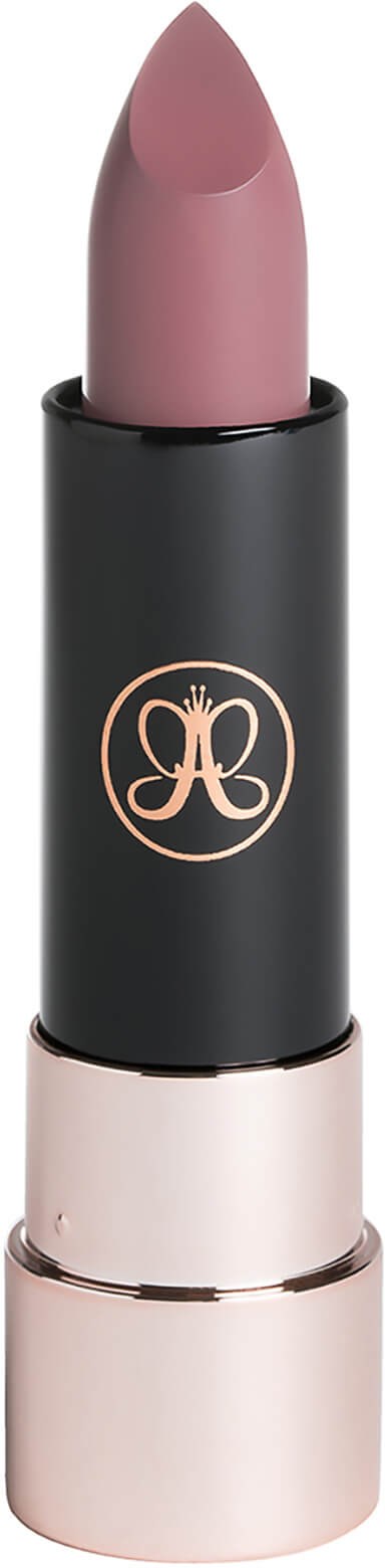 A lipstick with a pink color in a sleek black and gold case. The case has a logo with a bow design.