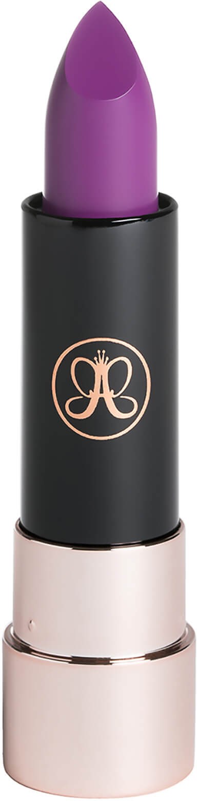 A purple lipstick in a black and pink case with a logo on it.