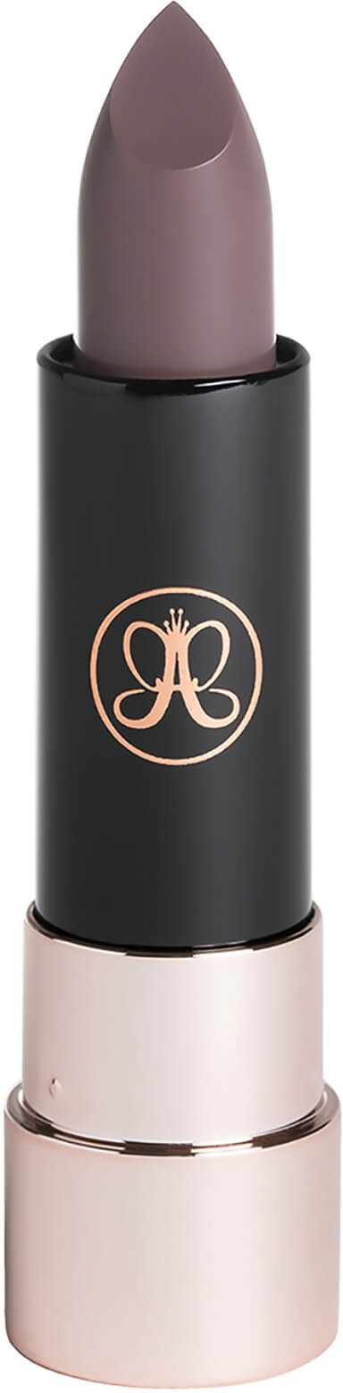 A lipstick with a black and gold casing, in a soft purple shade.
