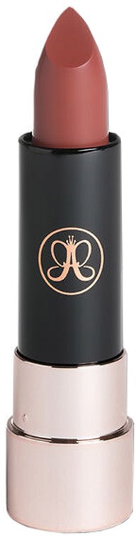 A lipstick with a pinkish-brown color inside a black and rose gold tube.