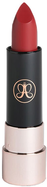 A red lipstick with a black case and gold emblem, standing upright.