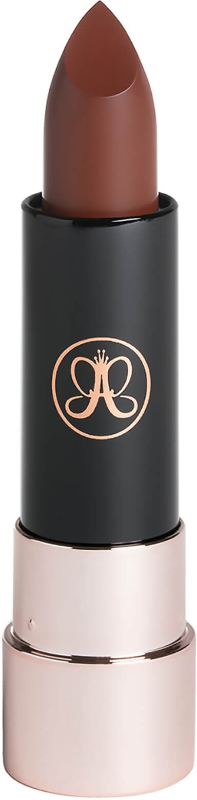 A brown lipstick in a black tube with a gold logo and a light pink base.