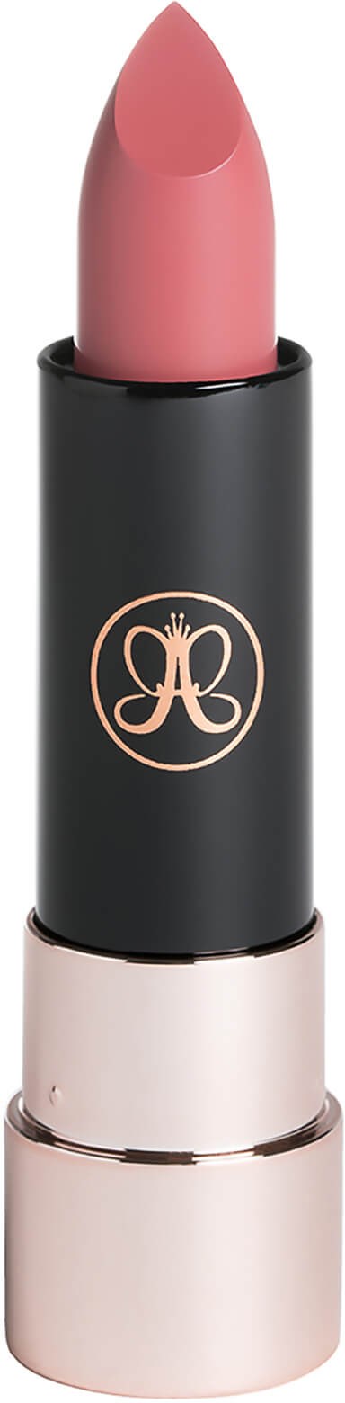 A pink lipstick in a black and pink case with a decorative logo on it.