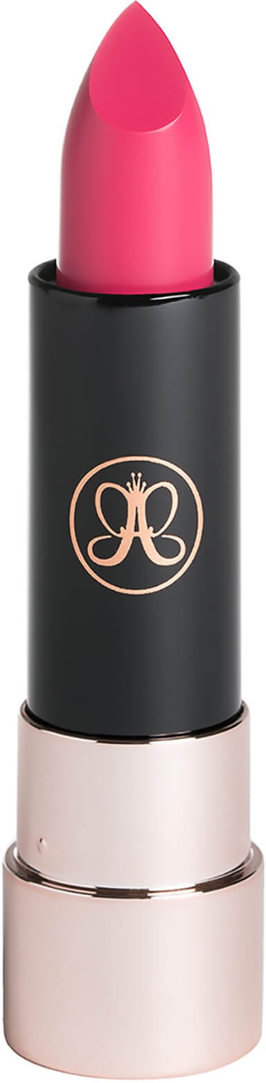 A pink lipstick in a black and gold tube.
