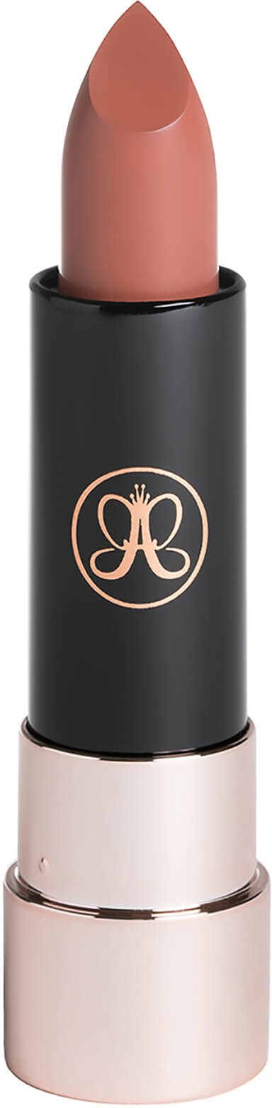A lipstick with a black and gold case and a pinkish-nude color.