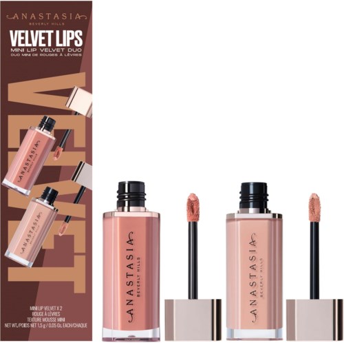 Velvet lip gloss with a doe-foot applicator in clear bottles, labeled with brand and product name, shown with applicators.