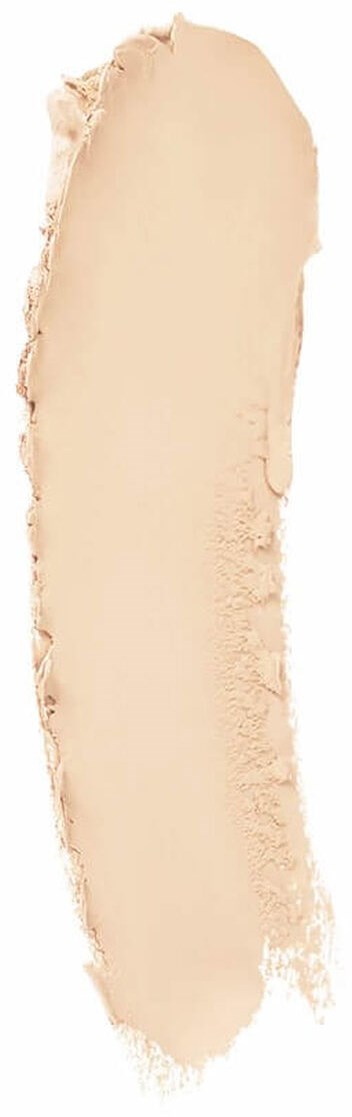 En beige smet av smink eller foundation på en vit bakgrund.