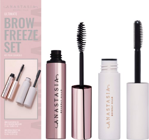 Øyenbrynsgelé og mascara i rosa og hvite flasker med store børster, en del av et Brow Freeze-set.