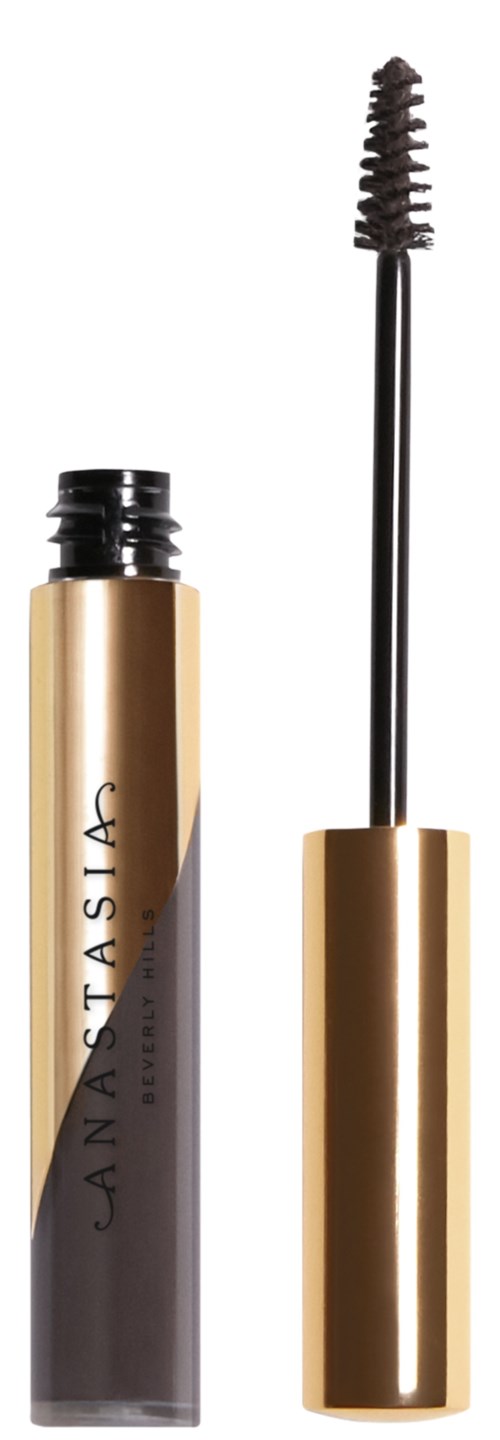 A gold and black mascara tube with the wand outside, showing the brush and the open container.