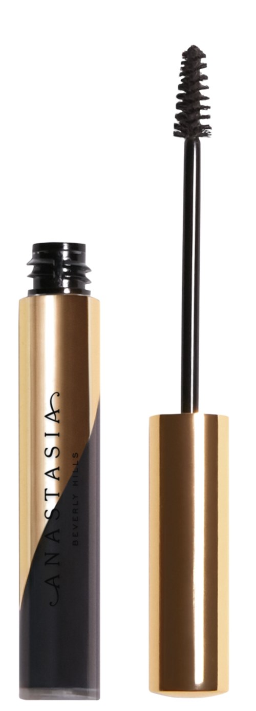 Ein Mascara-Tube mit goldener Kappe und schwarzem Körper und ein offener Applikator mit Spiralbürste.