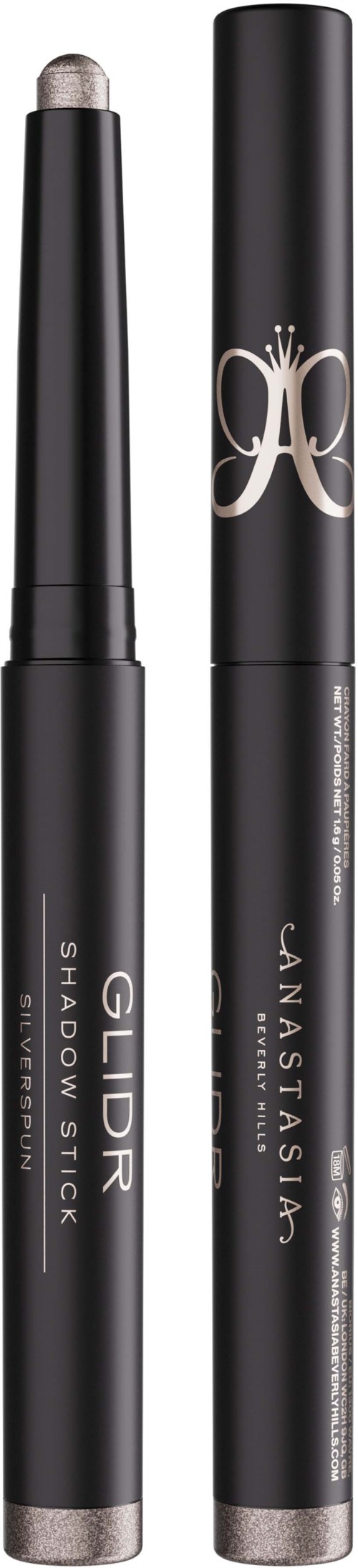 To svarte kosmetikkpenner med sølvdetaljer, den ene merket 'GOLD SHADOW STICK' og den andre med en dekorativ logo.