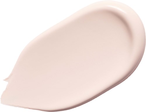 En beige, krämig substans med släta, rundade kanter, spridd i en tårform.