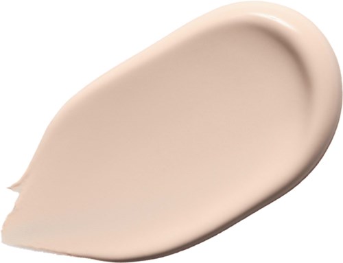 Krämfärgad lotion eller foundation som strukits på en yta.